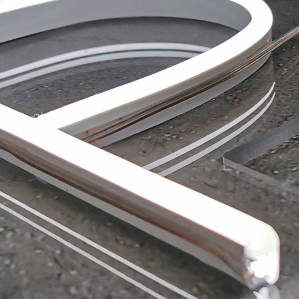 Close-up of a white neon LED tube on clear acrylic, showing its smooth, even edges and clean lines, V360 Photobooths
